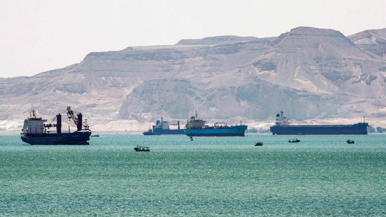 Tanker and freight ships near the entrance of the Suez Canal, by Egypt's Red Sea port city of Suez. Picture: Ahmed Hasan/AFP