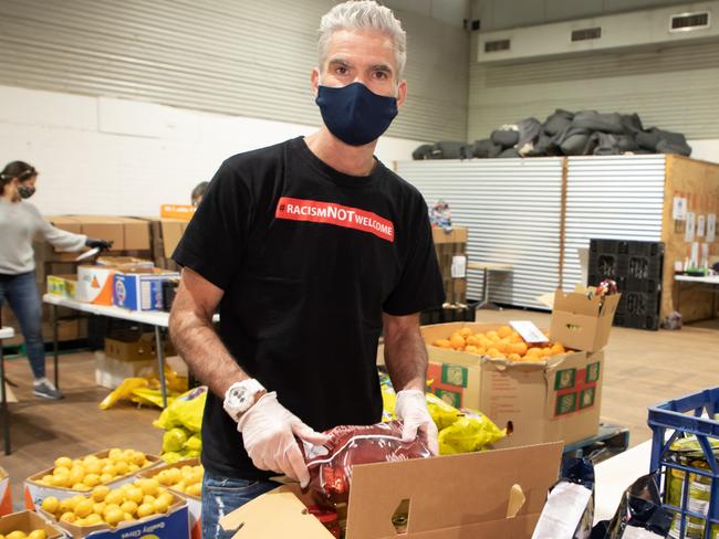 Craig Foster at Addi Road Emergency Food Relief Hub in Marrickville. SecondBite, City of Sydney and Coles have banded together to provide vital food relief to vulnerable Sydney residents by donating and delivering the equivalent of 158,750 meals to individuals and families impacted by COVID-19. PLEASE CREDIT - Pictures - Chris Pavlich Photography