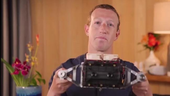 Meta CEO Mark Zuckerberg shows a prototype headset for the metaverse.