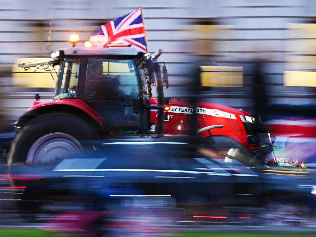 Farmers drive tractors near the Houses of Parliament in London during a demonstration over cheap food imports, advocating for safeguarding British food security and standards. Picture: Leon Neal/Getty Images