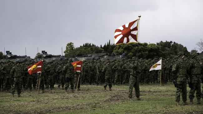 Soldiers of Japanese Ground Self-Defense Force (JGSDF), the  brand-new Marinesnamed The Amphibious Rapid Deployment Brigade attend a ceremony in Camp Ainoura in Sasebo, Nagasaki Prefecture, Japan on April 7, 2018, as Japan seeks to expand the the military defend against North Korea's nuclear and missile programs and China's maritime assertiveness over theSenkaku Islands. The launch of the Ground Component Command to provide unified command over regional armies and the Amphibious Rapid Deployment Brigade, Japan's version of the U.S. Marines. (Photo by Richard Atrero de Guzman/NurPhoto via Getty Images)