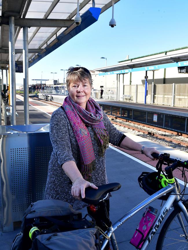 Regina Wilson readies to board with her bike at St Clair.