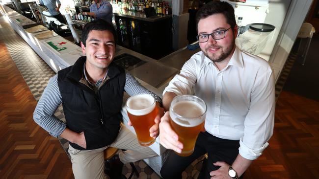 Coby Mellor, 32, and David Heah, 26, enjoying a beer at the Cathedral Hotel, across the road from the Adelaide Oval. Picture: Tait Schmaal.