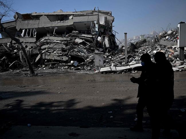 Turkish police officers patrol carry out search operations among the rubble of collapsed buildings in Kahramanmaras. Picture: AFP