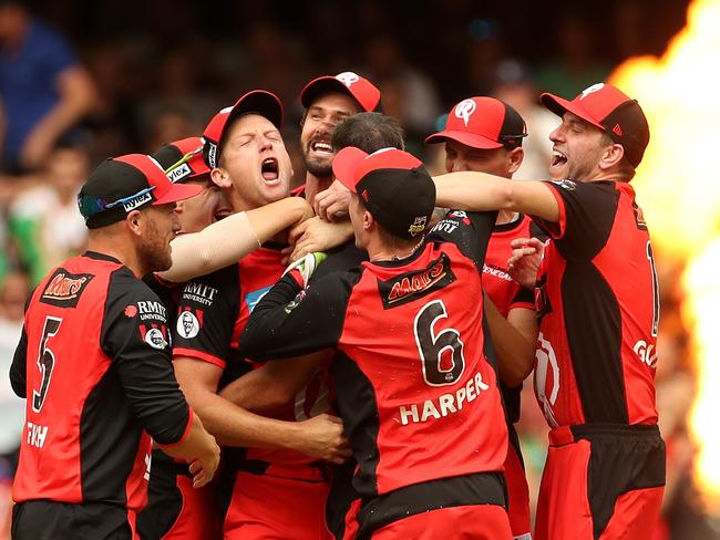 Renegades players celebrate after winning the Big Bash League (BBL) match final between the Melbourne Renegades and the Melbourne Stars at Marvel Stadium in Melbourne, Sunday, February 17, 2019. (AAP Image/Mark Dadswell) NO ARCHIVING, EDITORIAL USE ONLY