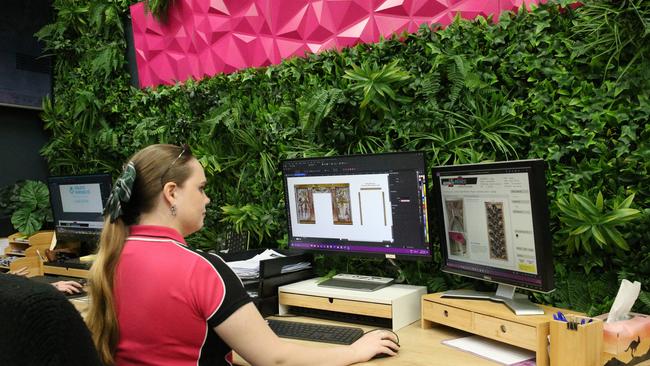 Graphic designer Megg Kemp’s job is to get the signage ‘print ready’. Picture: Molly Frew