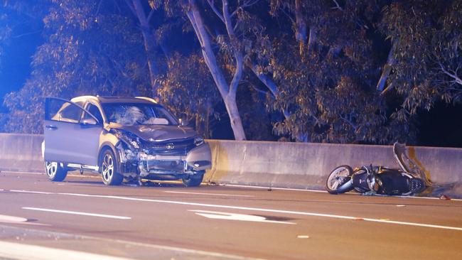 Police allege the Honda hit the motorcycle while it was stopped at a red light. Picture: Steve Tyson