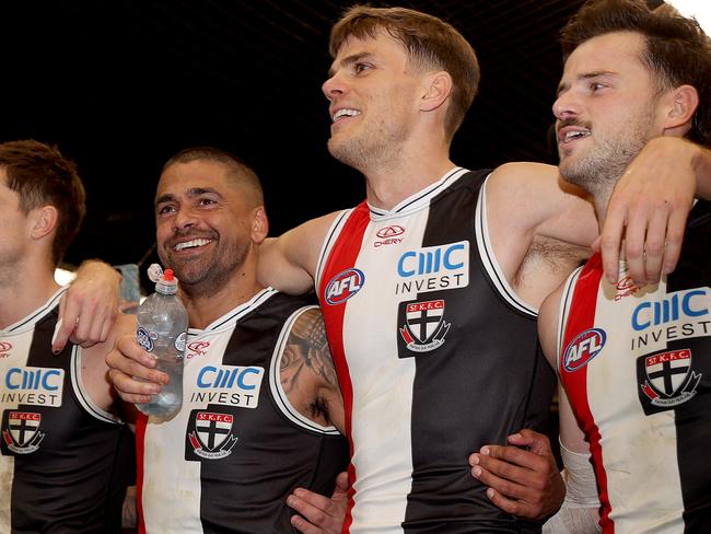 MELBOURNE, AUSTRALIA - JULY 07: Bradley Hill, Mason Wood and Jack Sinclair of the Saints the song after the win during the round 17 AFL match between St Kilda Saints and Sydney Swans at Marvel Stadium, on July 07, 2024, in Melbourne, Australia. (Photo by Kelly Defina/Getty Images)