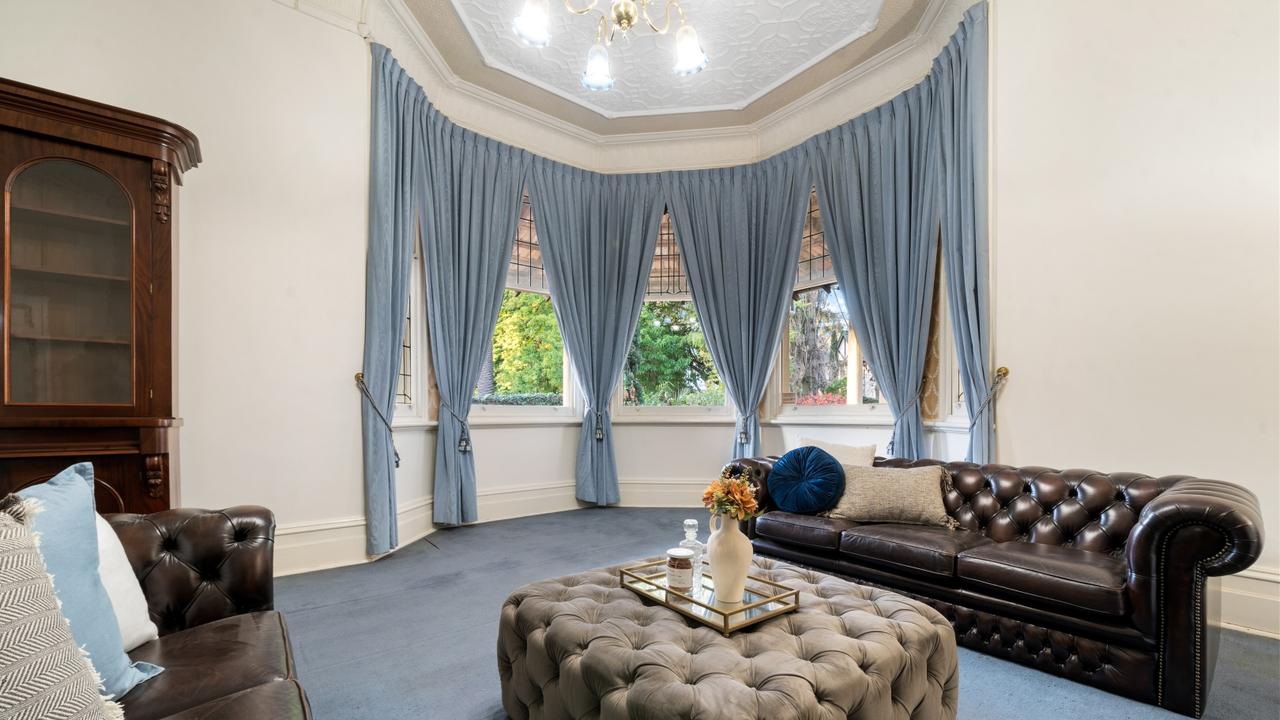 A spacious formal sitting room with an prominent bay window comes off the ‘grand entryway’. Picture: realestate.com.au.