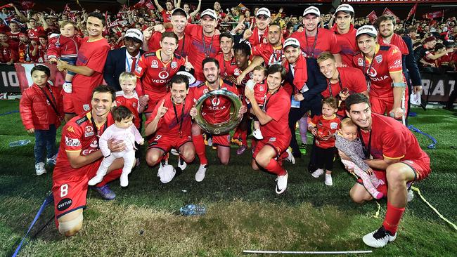 Adelaide United players and their children celebrate their title win. Picture: Daniel Kalisz/Getty Images