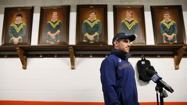 Wallabies five-eighth Bernard Foley at Leichhardt Oval in Sydney yesterday in front on images of Balmain Tigers Test rugby league players