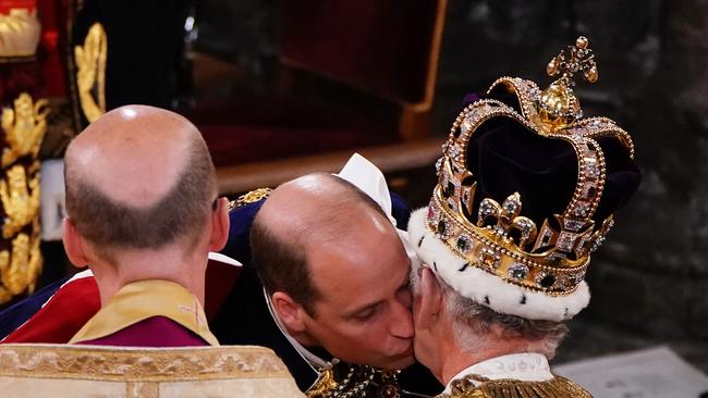 Prince William kisses his father, King Charles III. Picture: Getty Images