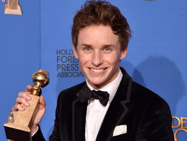 Redmayne with his Golden Globe Award for Best Performance in a Motion Picture — Drama.