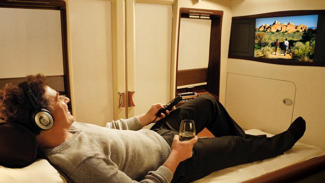 This lucky guy has plenty of room to stretch out in his first class seat on a Singapore Airlines A380 airliner.