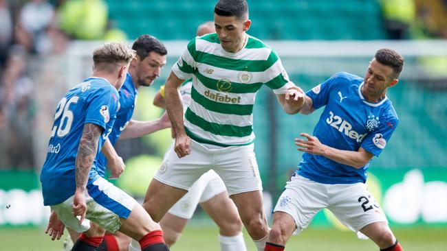 Graham Dorrans in his Rangers days taking on Aussie Tom Rogic from arch rivals Celtic Picture: EPA/Robert Perry