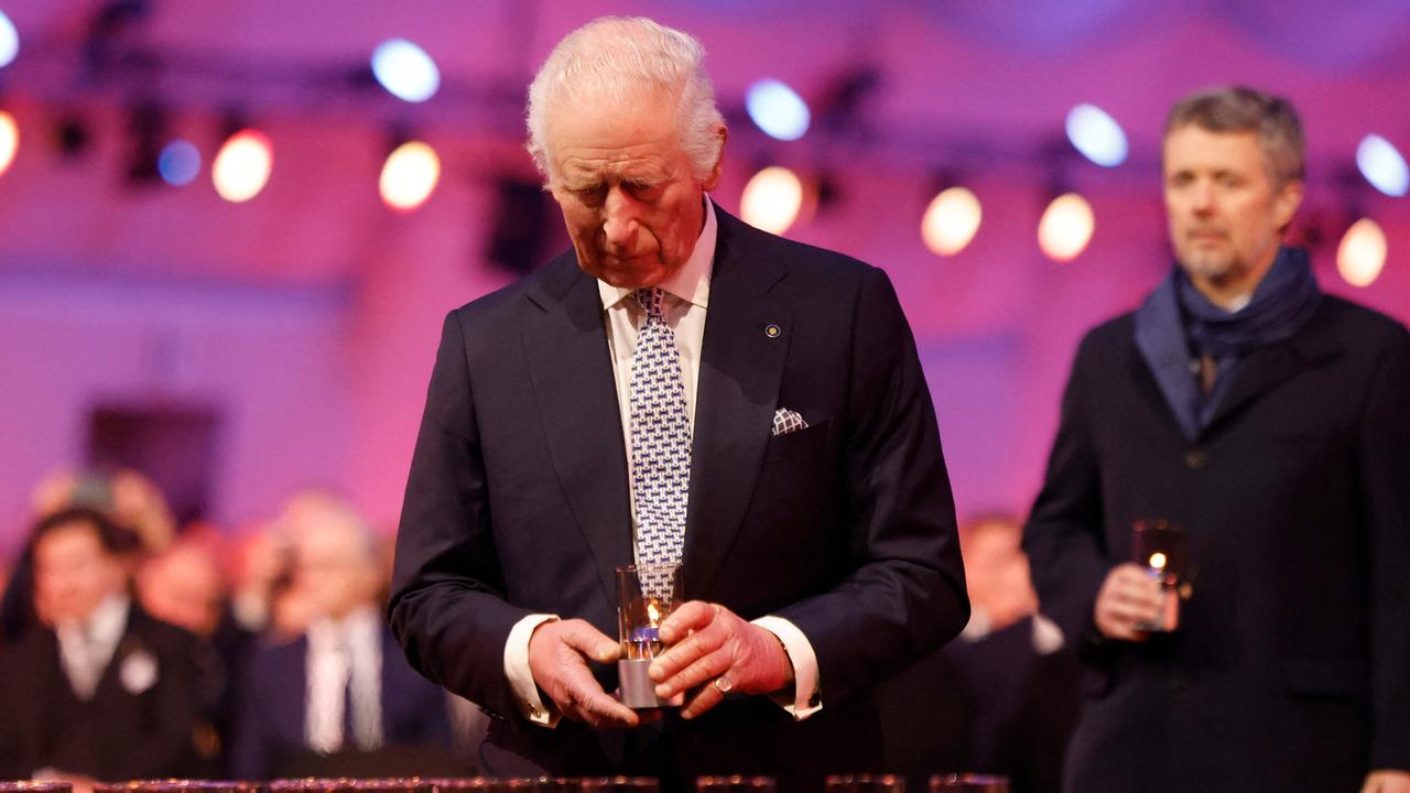 Britain's King Charles III lays a candle during the commemorations on the 80th anniversary of the liberation of Auschwitz-Birkenau. Picture: Wojtek RADWANSKI/AFP