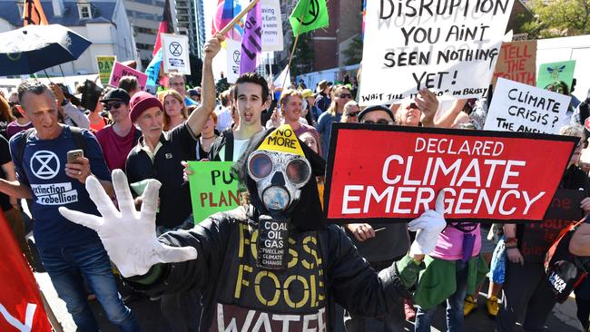 Extinction Rebellion protestors block the corner of Margaret and William Streets in Brisbane oin August 6, More protests are planned for coming weeks. Picture: AAP Image/Darren England