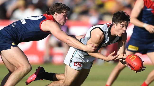 Connor Rozee gets a handball away under pressure. Picture: Felicity Elliott/AFL Photos via Getty Images