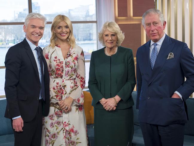 Presenters Philip Schofield and Holly Willoughby pose for a photo with Queen Camilla and King Charles. Picture: Geoff Pugh - WPA Pool/Getty Images