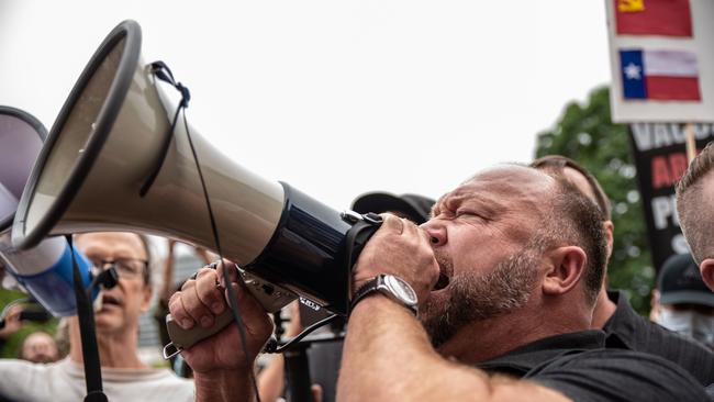 Infowars founder Alex Jones speaks into a bullhorn at the Texas State Capital building on April 18 during an anti-lockdown rally.