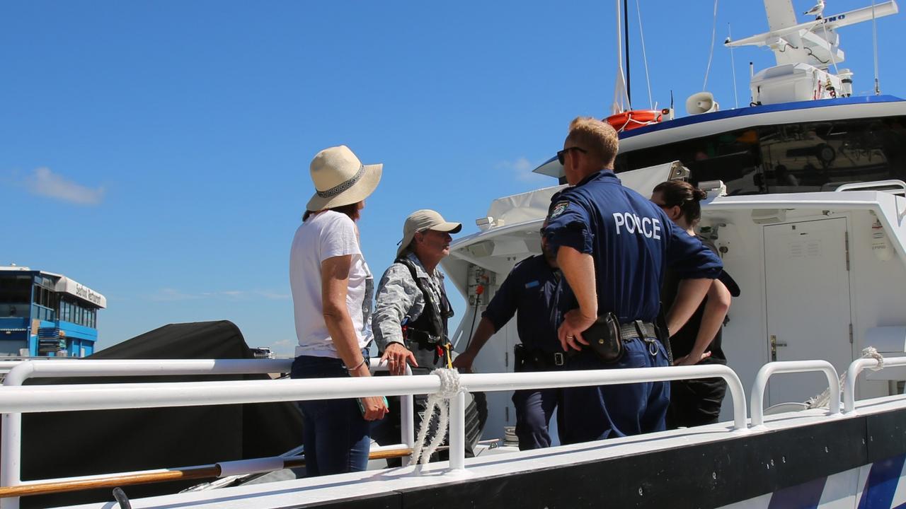 The crew of the Solar Coaster with their rescuers on board a police boat at Nelson Bay, Port Stephens. Picture: Supplied by NSW Police