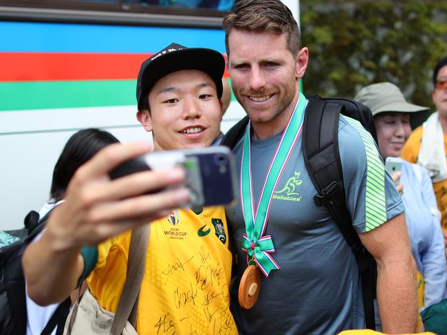 ODAWARA, JAPAN - SEPTEMBER 11: Bernard Foley of Australia poses for a picture with locals following an Australian Wallabies training session at Odawara Stadium on September 11, 2019 in Odawara, Kanagawa, Japan. (Photo by Dan Mullan/Getty Images)