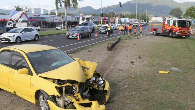 An early model Mitsubishi Lancer crashed into a light pole on Anderson St last week and was towed from the scene by Barron River Towing. The driver of the vehicle was seen running from the crash. Picture: Peter Carruthers