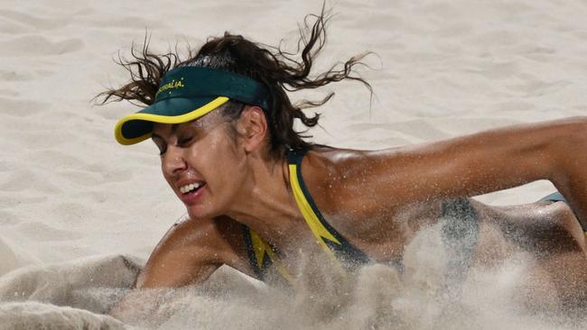 Australia's #02 Taliqua Clancy fails to reach the ball in the women's bronze medal beach volleyball match between Australia and Switzerland during the Paris 2024 Olympic Games at the Eiffel Tower Stadium in Paris on August 9, 2024. (Photo by Jeff PACHOUD / AFP)