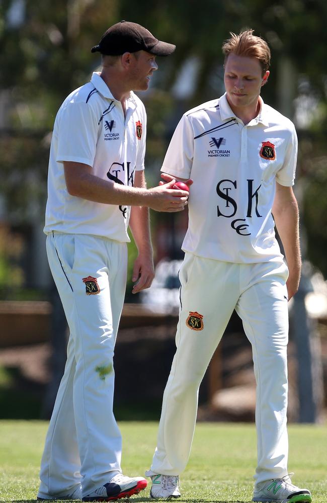 Josh Bartlett has a chat with St Kilda captain Michael Beer. Picture: Mark Dadswell