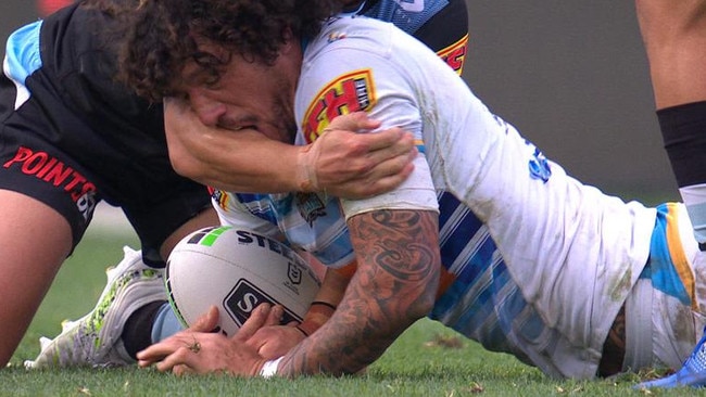 Kevin Proctor bites the arm of Shaun Johnson.