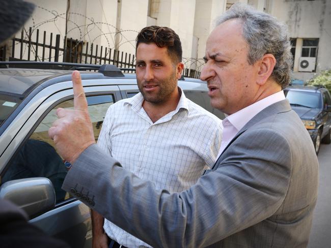 Ali Elamine with his lawyer Hussein Berjawi leaving the Palace of Justice, Baabda, Lebanon. Picture: Liam Kidston.