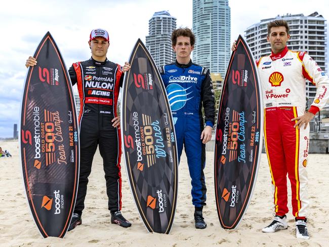 Supercars drivers James Golding, Aaron Love and Andre De Pasquale with the 2024 GC500 trophies on Surfers Paradise beach. Picture: Supplied