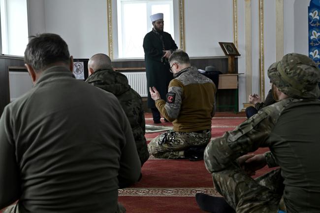 Worshippers at prayers in a mosque near Ukraine's eastern front