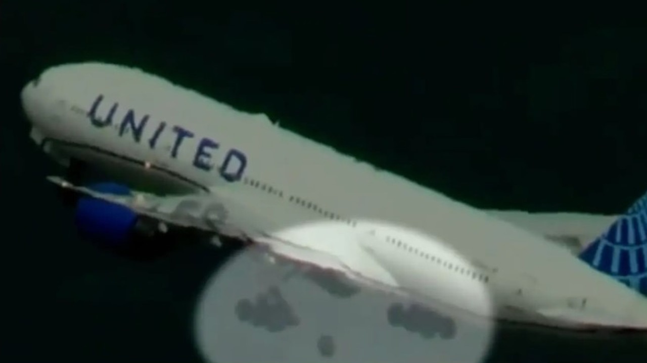 A tyre can be seen falling off a United Airlines Boeing 777-200 bound for Japan. Picture: ABC7