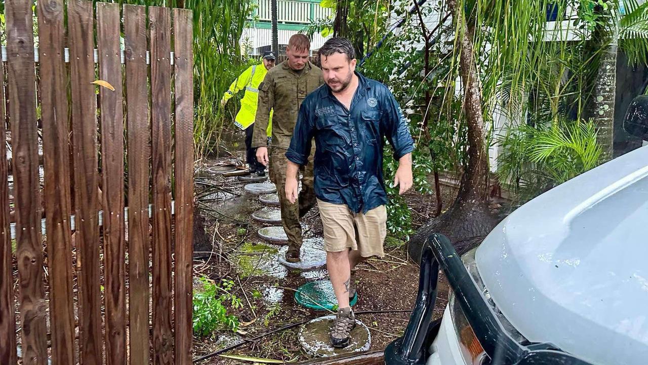 Herbert MP Phillip Thompson doorknocks Townsville suburbs with Queensland Police and the army.