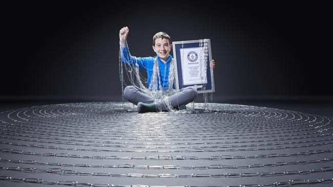 Ben Mooney didn’t let magpies stop him claiming the longest paperclip chain world record. Picture: Guinness World Records