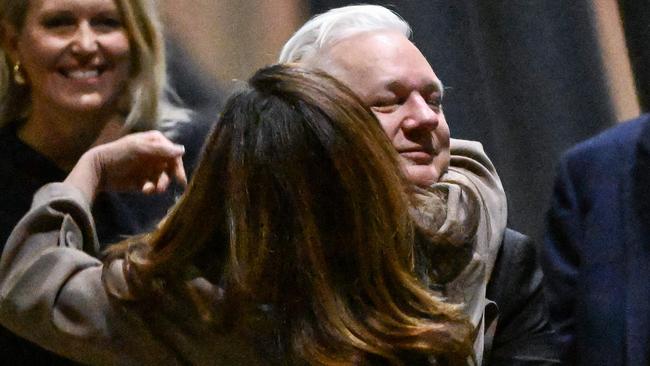 WikiLeaks founder Julian Assange hugs his wife Stella after arriving at Canberra Airport on Wednesday. Picture: AFP