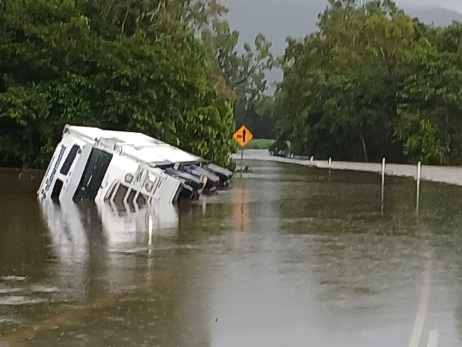 A truck came to grief attempting to navigate floodwaters covering the flood-prone Bruce Highway north of Ingham overnight. Picture: Supplied