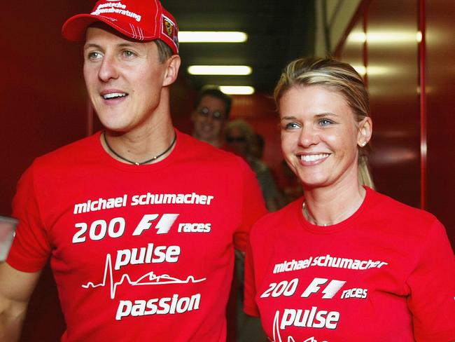 BARCELONA, SPAIN - MAY 9:  Michael Schumacher of Germany and Ferrari celebrates with his wife Corrina after competing in his 200th Grand Prix during the Spanish F1 Grand Prix on May 9, 2004, at the Circuit de Catalunya in Barcelona, Spain. (Photo by Getty Images)