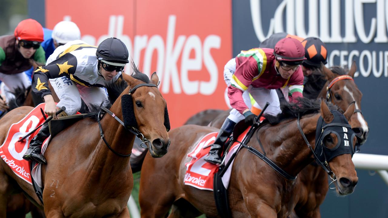 Entain Group Pty Ltd, which owns Ladbrokes, among other bookmakers, is being investigated by Australian federal agents. The Ladbrokes logo is visible in the background. (AAP Image/Mal Fairclough)