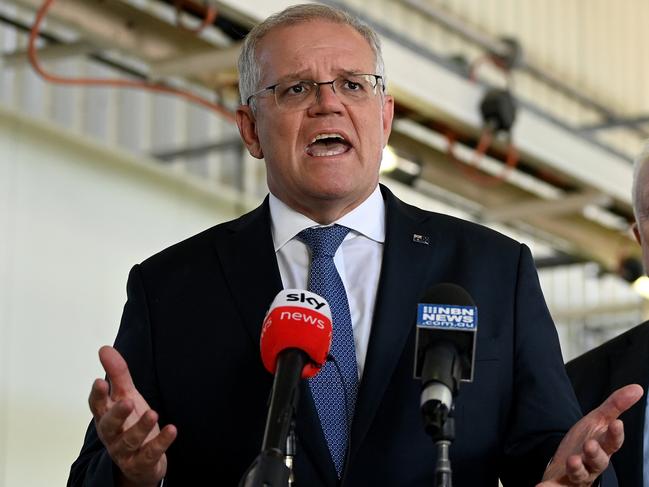 Australian Prime Minister Scott Morrison (left) and Federal Liberal candidate for Dobell Michael Feneley speak to the media during a visit to FMC Australia in Wyong, on the Central Coast of New South Wales, Monday, March 14, 2022. (AAP Image/Bianca De Marchi) NO ARCHIVING