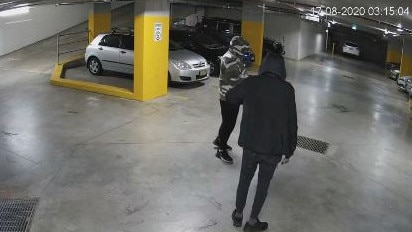 A still image from CCTV security footage of two people who Northern Beaches detectives want to speak with in relation to an arson attack in the underground car park of a block of units at Brookvale. Picture: NSW Police