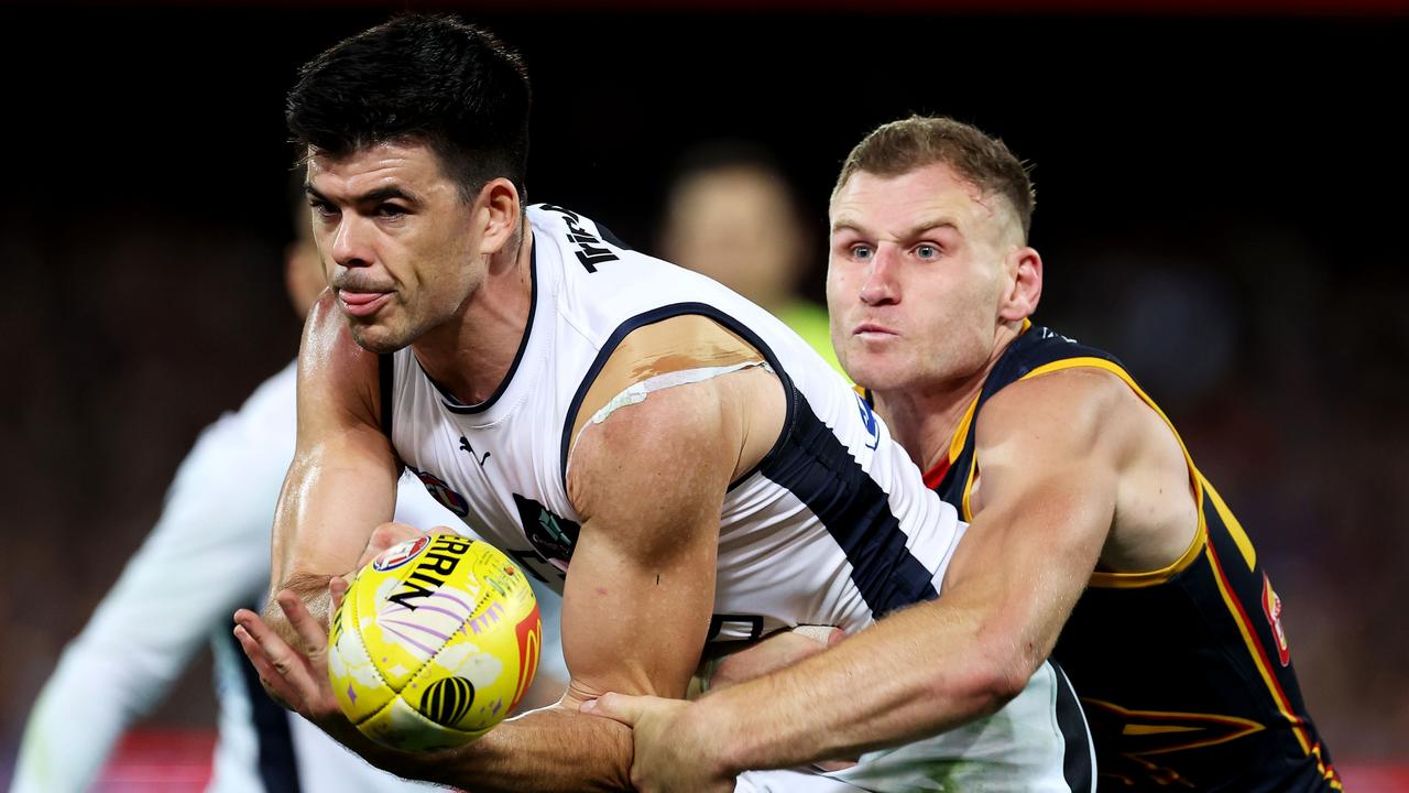 Matthew Kennedy of the Blues is tackled by Rory Laird of the Crows. Picture: James Elsby/AFL Photos via Getty Images