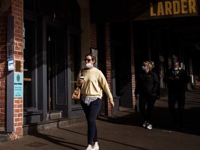 BALLARAT, AUSTRALIA - SEPTEMBER 10: People walk along Vincent Street on September 10, 2021 in Daylesford, Australia. Lockdown restrictions have eased across regional Victoria except for the greater Shepparton area. The five reasons to leave the home no longer apply for residents in regional Victoria, except for Greater Shepparton. There is no limit on the distance regional Victorians can travel from home Ã¢â¬â other than restrictions on entry to metropolitan Melbourne. Most businesses and venues are able to reopen with capacity and density limits, while office workers will be able to return to their places of work with a capacity of up to 25 percent or up to 10 people, whichever is greater. Metropolitan Melbourne and the Greater Shepparton area remain under lockdown restrictions as authorities continue to work to contain the ongoing COVID-19 outbreaks in those areas. (Photo by Darrian Traynor/Getty Images)