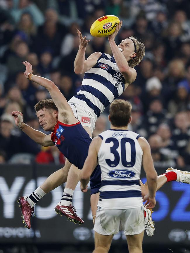 Zach Guthrie flies high over the top of Kade Chandler. Picture: Michael Klein