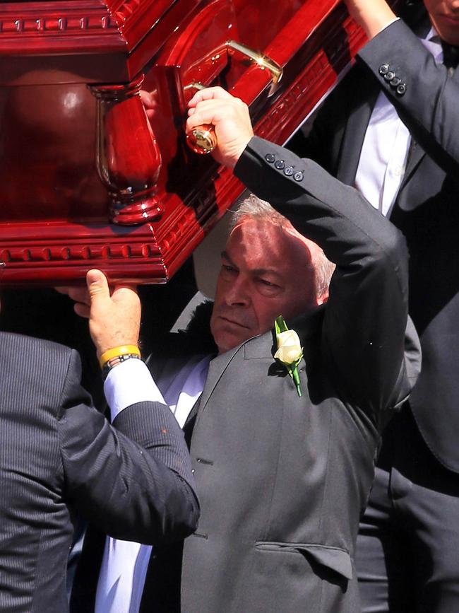 Borce Ristevski carries his wife’s coffin. Picture: The Australian