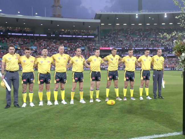 AFL players, umpires and fans have paid an emotional tribute to slain couple Jesse Baird and Luke Davies moments before the season-opening clash between Sydney and Melbourne.Mr Baird, a former AFL umpire, and Mr Davies, a Swans fan, were allegedly murdered by police officer Beau Lamarre-Condon last month. Picture: Twitter/@AFL