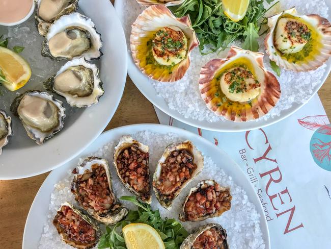 Cyren Bar Grill Seafood’s scallops, natural oysters and Oysters Kilpatrick. Picture: Jenifer Jagielski