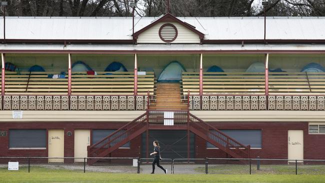 Tents can be seen hidden in the back of the Heritage listed grandstand. Picture: David Caird