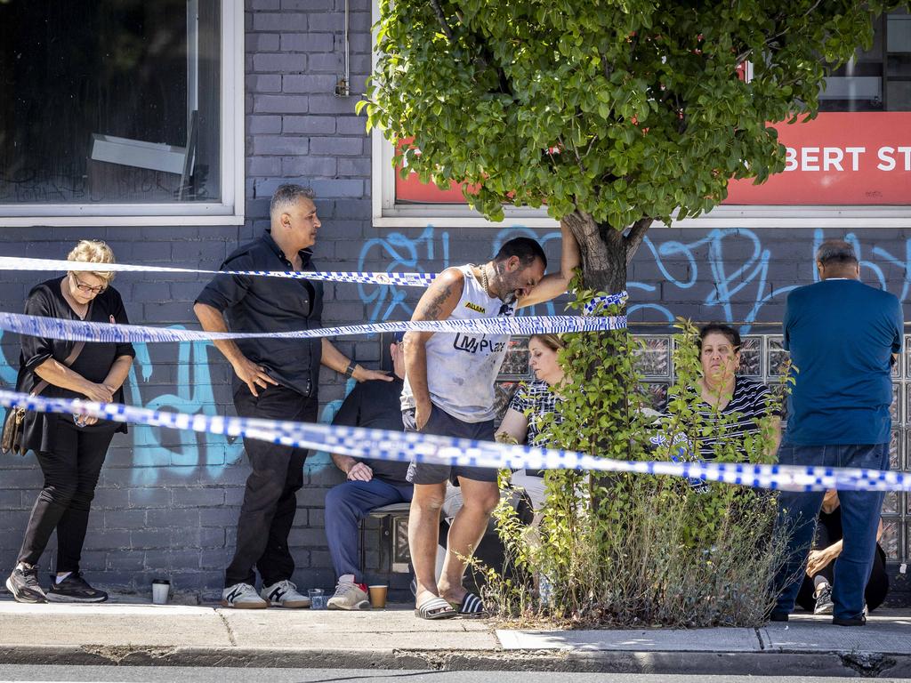 Grieving family and friends at the site where Abdulrahim was killed. Picture: Jake Nowakowski